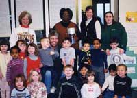 Ms. Daniel, her students and preschool children